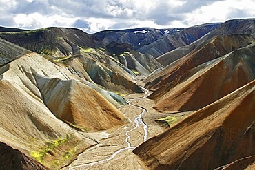 View into a river valley of the colourful Rhyolith Mountains of Landmannalaugar, Iceland, Europe