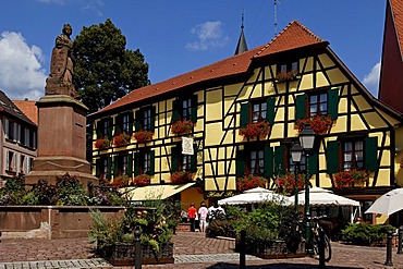 Fountain in front of a hotel in Ribeauville, Alsace, France, Europe