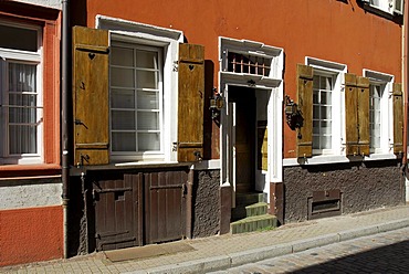 Front door, facade with the traditional wooden shutters on a road in the historic center of Heidelberg, Neckar Valley, Baden-Wuerttemberg, Germany, Europe