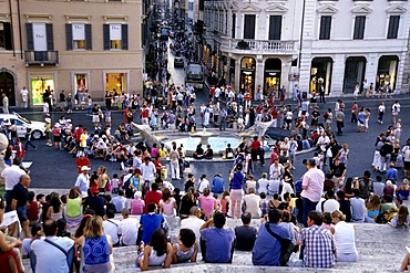 People populating Spanish Steps, Piazza di Spagna, Scalinata della Trinita dei Monti, view from above of the Via dei Condotti, Rome, Italy, Spain, Europe