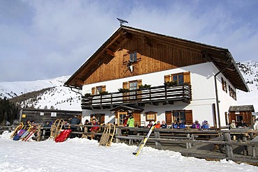 Hikers taking a break at the Alpe Nemes mountain hut in the High Puster Valley or Alto Pusteria, Bolzano-Bozen, Italy, Europe