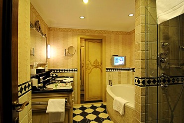 Bathroom with flatscreen monitor in Gstaad Palace Hotel, Gstaad, Western Alps, Bernese Oberland, Switzerland, Europe