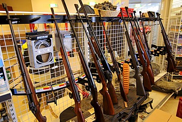 Shot guns in a Tasiilaq supermarket, Ammassalik, East Greenland, Greenland