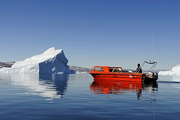 Boat and iceberg, Stoklund Fjord, East Greenland, Greenland