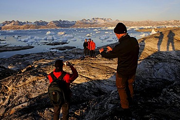 Hikers, trekking in the Sermilik-Fjord, East-Greenland, Greenland