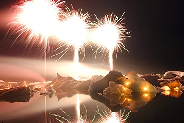 Fireworks on icebergs, glacier, Joekulsarlon, Iceland, Europe