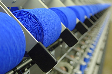 Spools of thread in a textile factory