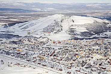 Aerial photograph of the city of Kiruna with the adjacent skiing area of Mount Luossavaara, Lappland, North Sweden, Sweden