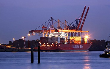 Containers being loaded on a ship in the port of Hamburg, Germany, Europe