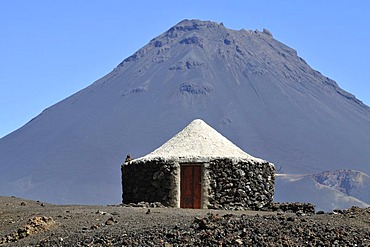 Traditional hut in front of the Pico de Fogo Volcano, Cha das Caldeiras, Fogo Island, Cape Verde Islands, Africa