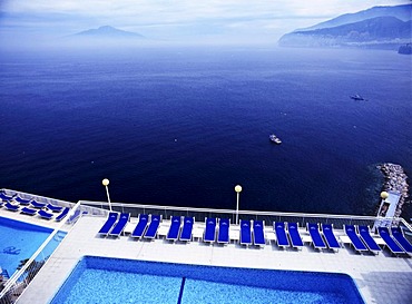 Swimming pool in Sorrent, in the gulf of Naples, Vesuv Volcano on the horizon, Italy, Europe