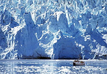 Fjord, edge of a glacier and a ship, Alaska, USA