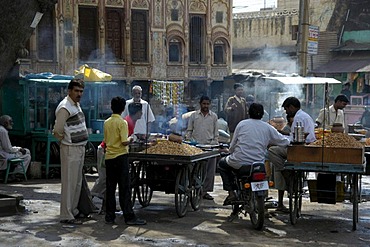 Street scene, men standing around smokey food stands, Lachmangarh, Rajasthan, India, Asia