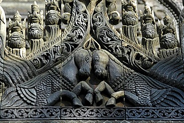 Ornate wooden carving, two horses, at a Buddhist Pagoda, Shwenandaw Kyaung, Golden Palace Monastery, Mandalay, Burma, Myanmar, Southeast Asia