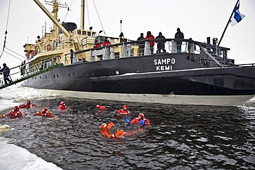 People swimming in the polar sea, Sampo icebreaker, Kemi, Lapland, Finland, Europe