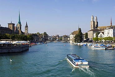 Limmat River, historic center of Zurich, looking onto the Fraumuenster abbey, the Peterskirche, or St. Peter's Church, and the twin towers of the Grossmuenster Church the symbol of the city, Zurich, Switzerland, Europe