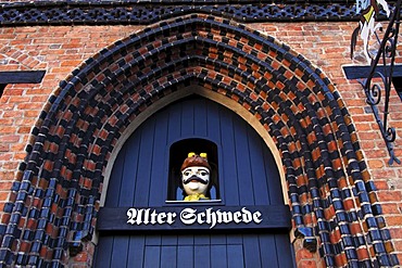 Entrance to restaurant "Alter Schwede", historic gothic style brick house in the Old Town of Wismar, UNESCO World Heritage Site, Mecklenburg-Western Pomerania, Germany, Europe