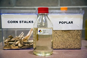 A bottle of ethanol and some of the materials ethanol can be made of at the National Renewable Energy Laboratory, operated by the US Department of Energy, where scientists are developing economical processes for making cellulosic ethanol from non-edible p