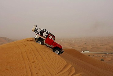 Vehicle on a sand dune, desert safari, Dubai, United Arab Emirates, Middle East