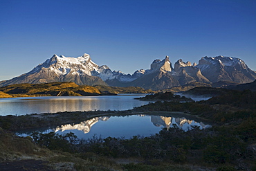 Morning fog and first light at the Torres del Paine massif at the lake Lago Pehoe, national park Torres del Paine, Patagonia, Chlie, South America