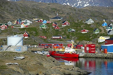 Vista of the city with port ship and colourful houses Ammassalik Eastgreenland