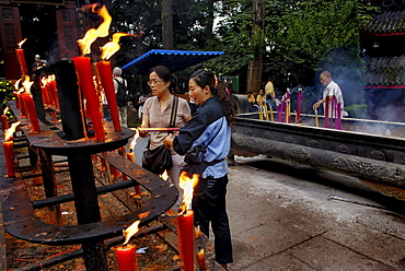 Votive candles and incenses, Wannian monastery, Mount Emei near Chengdu, China, Asia