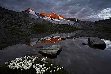 Reichenspitze peak reflected in the upper Gerlossee lake, Zillertal Alps, North Tyrol, Austria, Europe