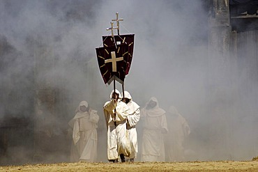 Monks in white cowls carries red flags with cross are befog, knight festival Kaltenberger Ritterspiele, Kaltenberg, Upper Bavaria, Germany