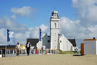 Tourists in front of beach cafe and church, Katwijk aan Zee, South Holland, Holland, The Netherlands