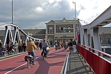 Cyclists on bridge near the main station, Middelburg Zeeland Holland the Netherlands