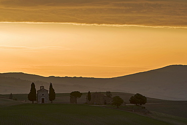 Typical Tuscan farm and small chapel at sunrise, Val d'Orcia, Tuscany, Italy, Europe