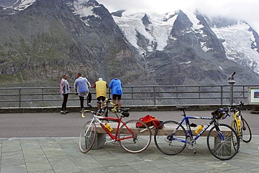 Bikers enjoying view from terrace at Franz Josefs Hohe at Grossglockner Carinthia Austria