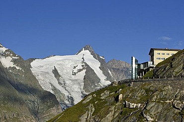 Early morning view of buildings on Franz Josefs Hohe in front of summit of Grossglockner Carinthia Austria