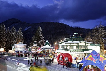 Bars and tents for the spectators around finish area first run ladies night slalom 12 29 2004 on Semmering in Lower Austria