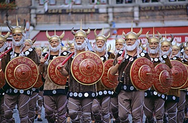 Singing vikings at procession in period dresses city of Brugge Belgium