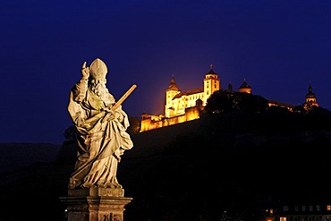 Fortress Marienberg and a statue of St.Kilian on the old bridge over the Main river, Wuerzburg, Bavaria, Germany