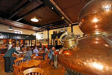 An old pot still (a giant copper kettle) used for the distillation in the Bushmills Whiskey Distillery, Bushmills, Londonderry, North Ireland