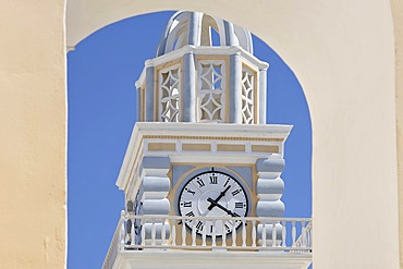 Tower with clock at the church Ag Ioannis Baptistis, Thira, Santorini, Greece