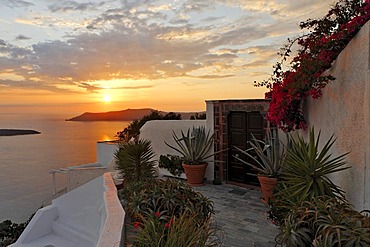 The village of Firostefani with the typical small alleys and the white painted houses at sunset, Firostefani, Santorini, Greece