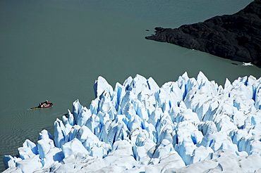 Blue ice of Glaciar Grey and a tour boat, Torres del Paine National Park, Patagonia, Chile