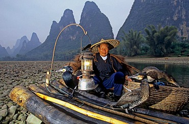 Typical fisherman with cormorants, Xingping, Guangxi, China, Asia