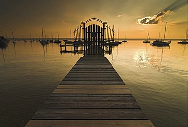 Sunset over a pier in Herrsching on Lake Ammersee, Bavaria, Germany, Europe