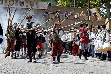 Folk in battle, historical medieval city parade, in Canellis, LÂ¥assedio di Canelli, Canelli, Asti Province, Piemont, Italy