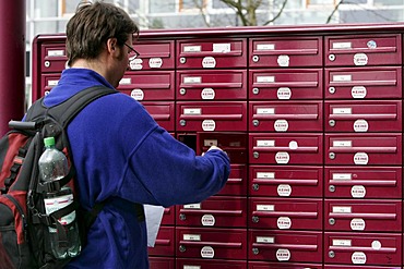 Man takes his letters out of the mail box