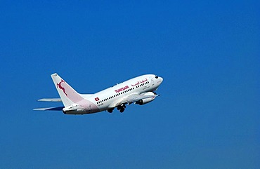 TunisAir airplane in the blue sky, Germany, Europe