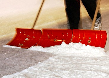 Snow cleaning with three snow shovels, Germany