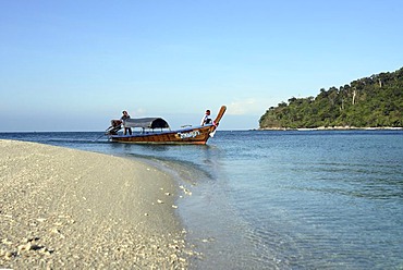 Longtail boat and sandy beach of the island Koh Adang inside Tarutao National Park - Andaman Sea , Thailand, Asia