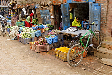 Locals buying and selling fish and vegetables in the market in the old town of Bhaktapur, UNESCO World Heritage Site, Kathmandu, Nepal, Asia