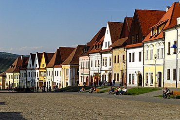 Historic town square of Bardejov surrounded by park benches and renovated old terraced buildings, UNESCO World Heritage Site,  Slovakia, Europe