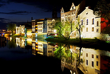 Facades, lit up, on the River Oder in Opole, Silesia, Poland, Europe